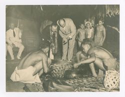 Roy Howard and other men at a luau