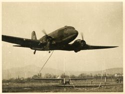 C-47 picking up glider