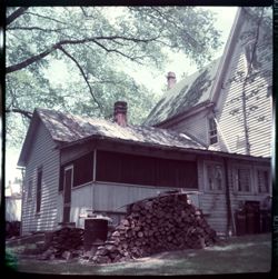 House with wood pile