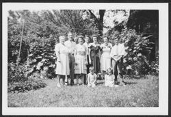 Nine members of the Robison family posing in yard during a family reunion at house on 3120 Graceland Avenue, Indianapolis, Indiana.