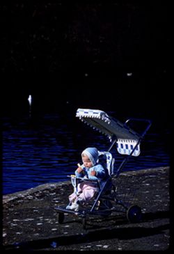 Blond baby in blue hood Stephane Palace of Fine Arts lagoon