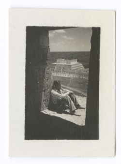 Item 1009. Similar shots of Eisenstein, Alexandrov and Tissé seated on the upper platform of the Castillo, seen through the doorway of the temple. The doorway is in heavy shadow, the men are leaning against the wall outside the door.