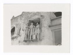 Item 0617b. Various shots of exterior of arena. Medium shot of three young women standing on balcony.