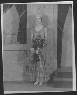 Martha Carmichael with bouquet of flowers.