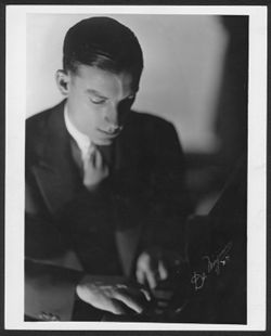 Portrait of Hoagy Carmichael playing the piano.