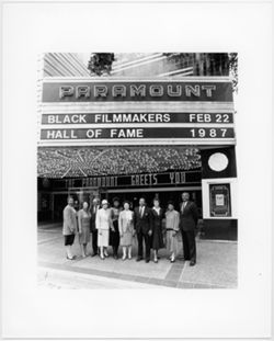 Black Filmmakers Hall of Fame members standing beneath event marque at the Paramount
