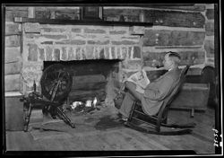 Cecil Crabb at fireplace