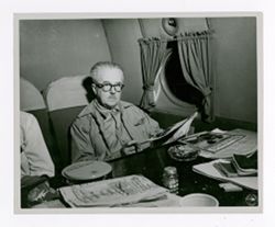 Roy Howard sitting in an airplane