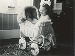 Unidentified girl playing with doll
