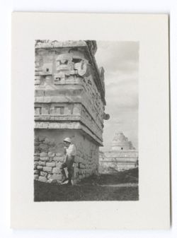 Item 1044. Same man at the southeast corner of the Iglesia, looking down, Caracol in background.