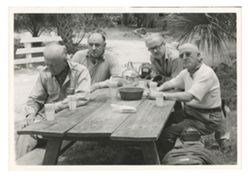 Roy Howard and company at a picnic table