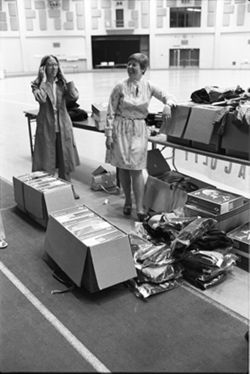 Cap and gown distribution at IU South Bend Commencement, 1976