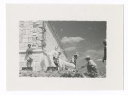 Item 1023. - 1025. Filming scene with young Indigenous man standing against wall of upper temple of the Temple of the Warriors. See also Items 171-173, 365-367 and 783-784 above.