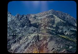 View up along Calif. 140 as it winds up Leevining Creek canyon toward high Tioga Pass, east gate to Yosemite.