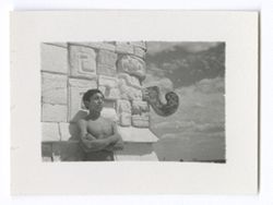 Item 0783. - 0784. Young man posing against wall of upper temple, Temple of the Warriors, See also Item 171-173 and 365-367 above.