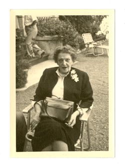 Woman sitting in lawn chair