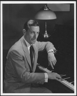 Publicity photo of Hoagy Carmichael at a piano.