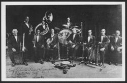 Publicity photograph of the King Oliver's Dixie Syncopators Plantation Café members holding their instruments.