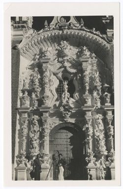 Item 57. Tissé and Eisenstein, with camera, standing in front of ornate doorway of church (?). See also photo Item 1185.