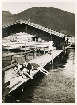 Women splashing and sunbathing at Lake Tegernsee, Germany