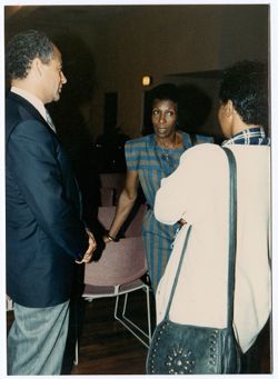 Michael Schultz talking with unidentified people during Pan Am Festival