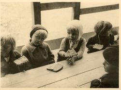 Polish children eating at DP Camp's nursery program