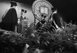 Graduates cross the stage at IU South Bend Commencement, 1973
