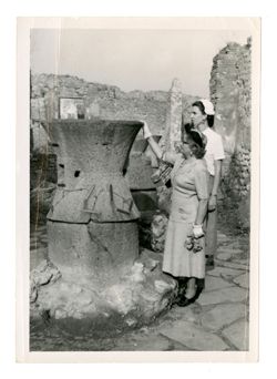 Margaret Howard and another woman standing next to an ancient kiln(?)