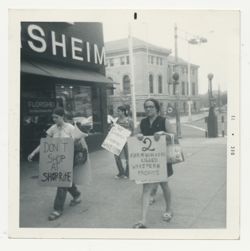 Women marching with signs protesting Shop-Rite and Wakefern