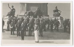 Item 42. Eisenstein standing in front of military unit on steps of Monument of Independence. See also photo Item 919