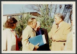 Hoagy Carmichael talking with two unidentified people at an Indiana University event.