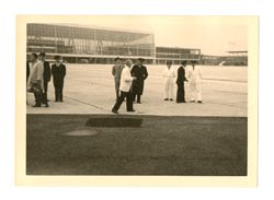Men standing on tarmac