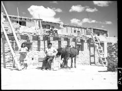 War chief and family, with horses and sled, Acoma