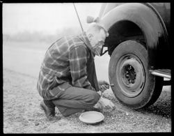Herb Miller changing tire out of Laredo