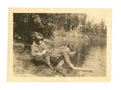 Jack and Jane Howard playing with a toy boat
