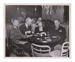 Roy W. and Peg Howard dining with couple