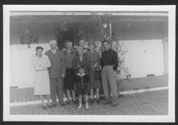 Ruth and Hoagy Carmichael, Hoagy Bix, Lida Carmichael and other family members posing in front of house.