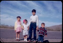 Four Mexican boys and girls on road to Sonoita, Sonora on Sunday afternoon