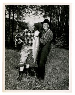 Roy Howard and another man holding a fish