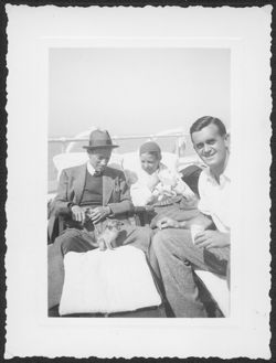 Hoagy Carmichael and Ruth Menardi, recently engaged, and unidentified man on ship coming back from the Teeward Islands with Harvey the monkey.