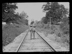 Tibbets coming down railroad--Tilden trip