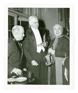 Roy W. Howard and two men