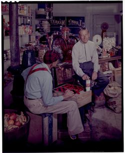 Color negative of Hoagy Carmichael and an unidentified man playing checkers in "Leon's Market."