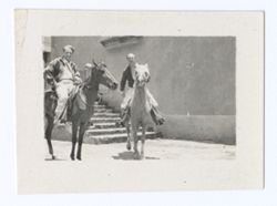Item 1153. Alexandrov and unidentified man on horseback in courtyard.