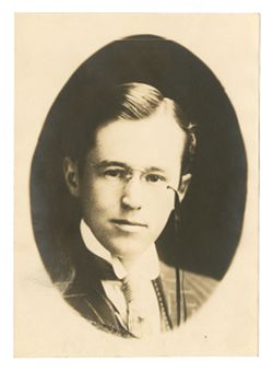 Young Roy Howard with glasses