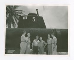Roy Howard stands outside Japanese submarine