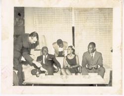 President William V. S. Tubman and others sit together