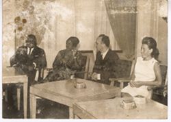 President and Mrs. Tubman seated at tables with guests
