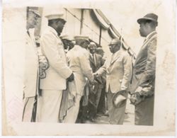 President William V. S. Tubman greets line of military officials