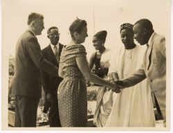 Ambassador C. T. O. King and other dignitaries exchange greetings